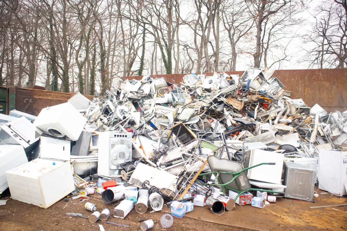 Large Bulky trash like washing machine, stove, oven, air conditioners collected and dumped in a pile for sorting